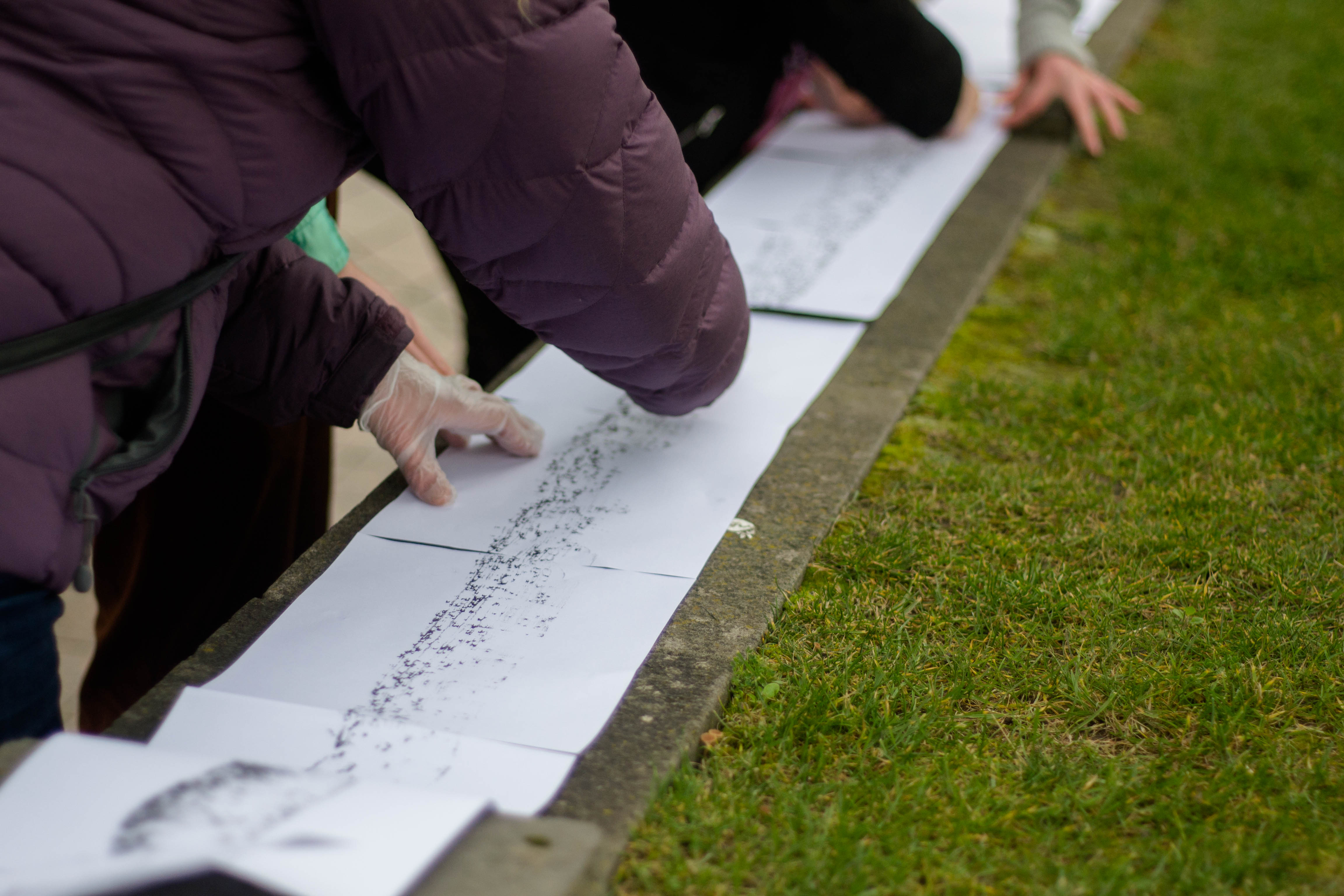Participants taking rubbings. Image credit: Lison Colin