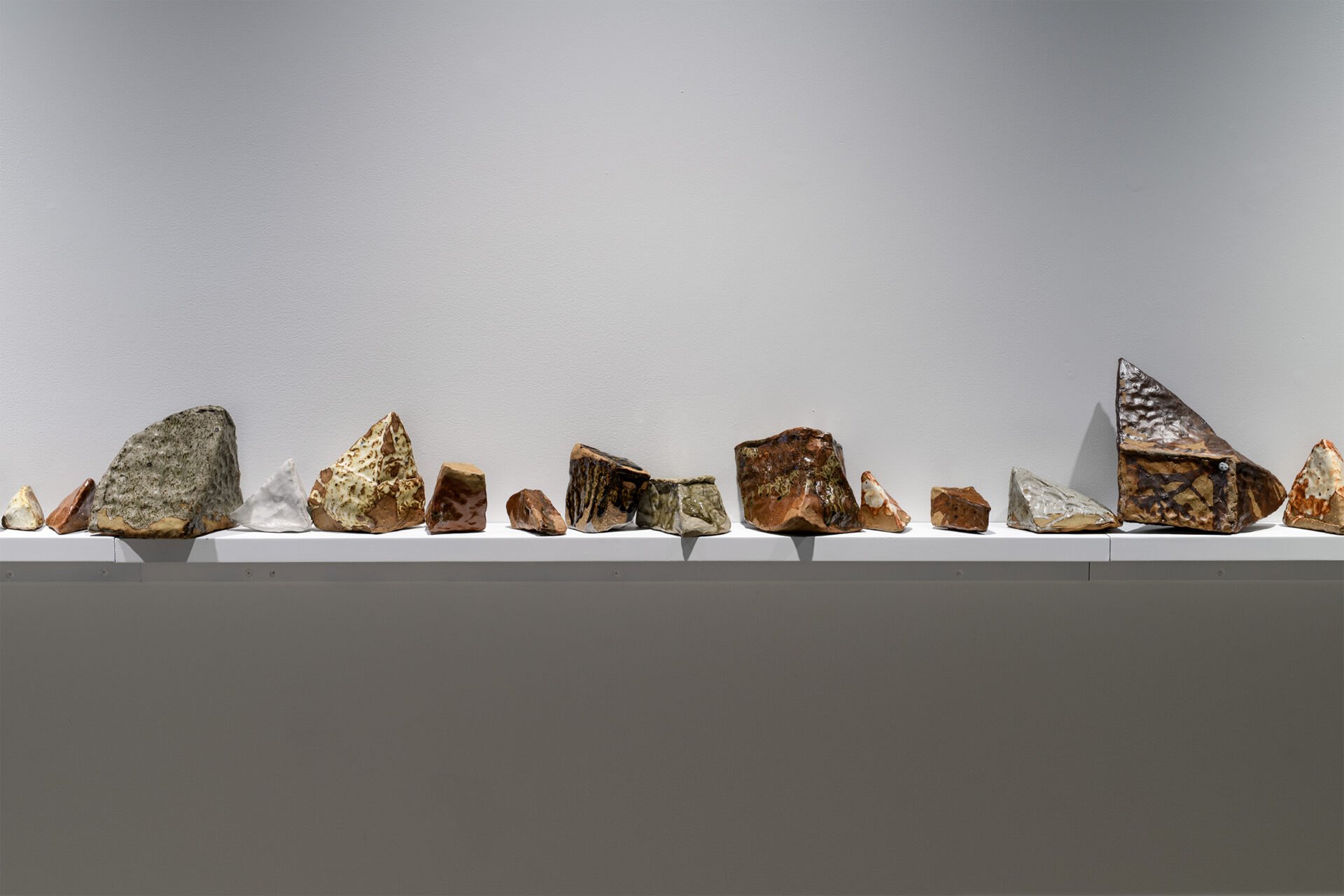 'We used to be a mighty mauka', Reclaimed clay, found ceramic and glass from Whaka Oho Rahi, Basalt from Blackhead Quarry, Rakiura Doc hut fireplace ash, Sage Green rock from Whaka Oho Rahi (Broad Bay), White Tāmaki Makaurau clay from Rowena and Barry’s house, Matatā pumice, Maukatere gold clay, Blue Whakatāne clay from Freddy, Chalky White rock from Whaka Oho Rahi, ash from Moewai’s Nan’s frieplace, Maukoroa from Karitāne, Grey River silt, Rakahuri clay, Logan Park kōkōwai from Aroha, 6100 x 200 mm, 2026