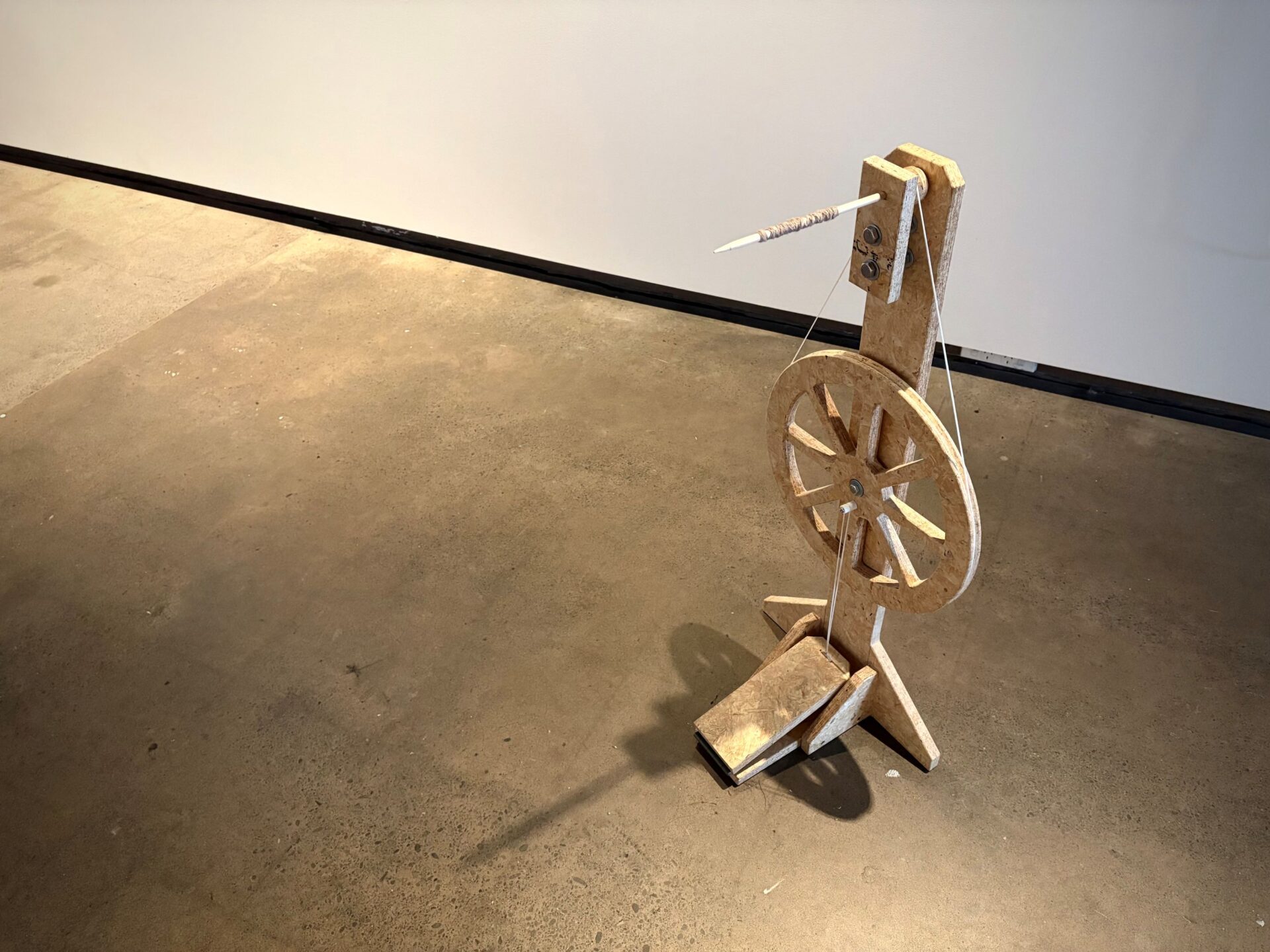 Georgie Walker, Ilam — Sculpture, Handcrafted Spinning Wheel, Pine wood, nails, string, plastic support, 900 x 400 x 300mm, 2026, photo credit Seoyoung Park